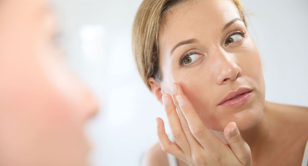 Woman looking at adult acne