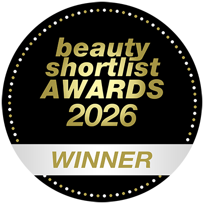 Round black and gold badge reading 'beauty shortlist AWARDS 2026' with a white band at the bottom and the word 'WINNER' in gold.