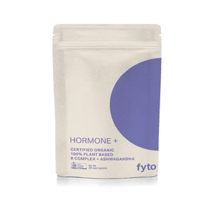 A stand-up pouch of Fyto Hormone + Certified Organic B Complex + Ashwagandha powder. The packaging is off-white with a large purple circular graphic on the right side and purple text.