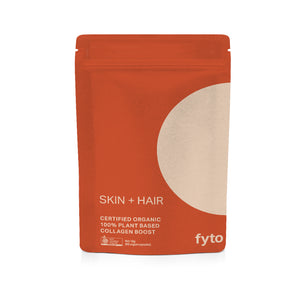 A stand-up pouch of fyto Skin + Hair Collagen Boost powder, featuring a terracotta orange design with a large beige circle on the right side and white text.