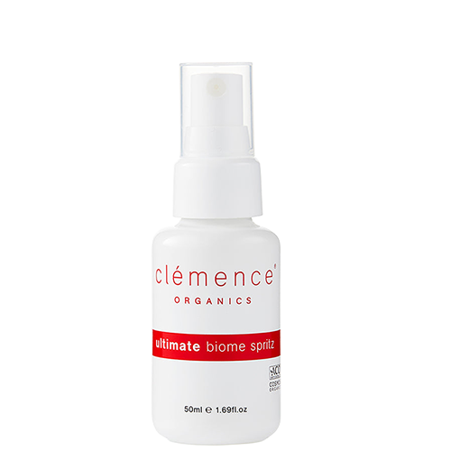 A 50ml white spray bottle of Clémence Organics Ultimate Biome Spritz with a clear cap and red text accents.