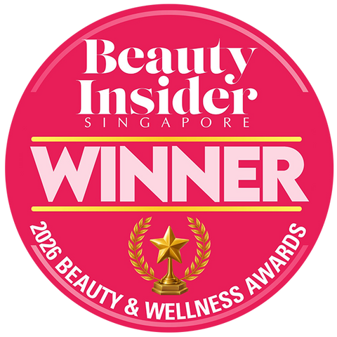 A circular pink Beauty Insider Singapore award badge with white text reading 'WINNER' and '2026 Beauty & Wellness Awards,' plus a gold trophy and laurel graphic in the center.