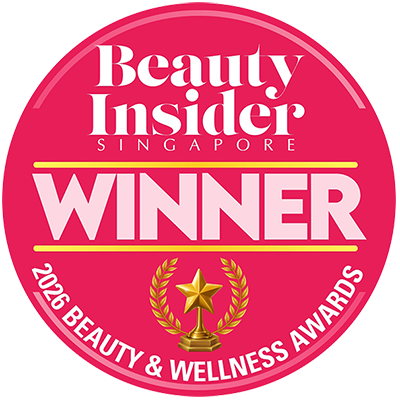A circular pink Beauty Insider Singapore award badge reading 'WINNER 2026 Beauty & Wellness Awards' with a gold trophy and laurel graphic in the center.